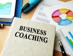 Business coaching notebook with charts