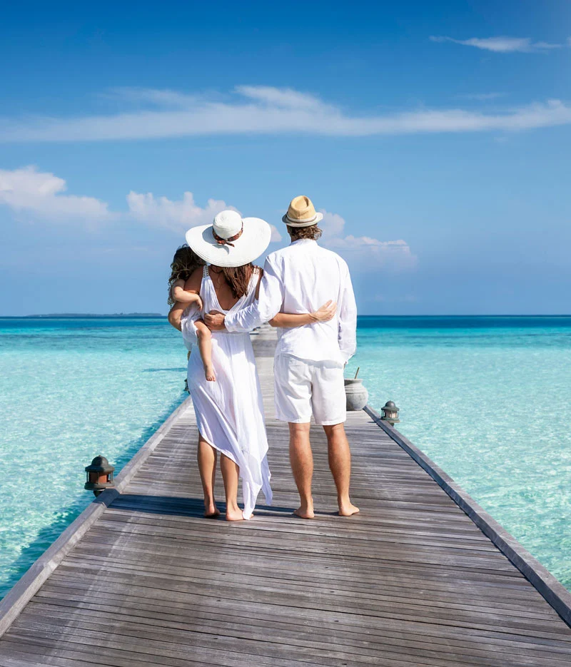 Couple walking along a seaside jetty
